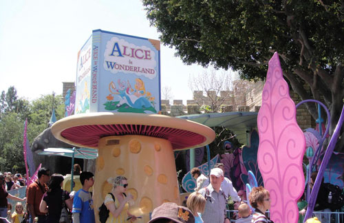Giant mushroom marking the entrance of Alice in Wonderland ride. The book sits on its top